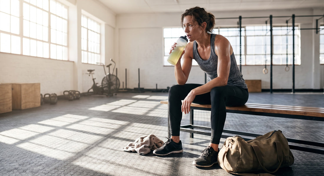 Person hydrating after a conditioning workout