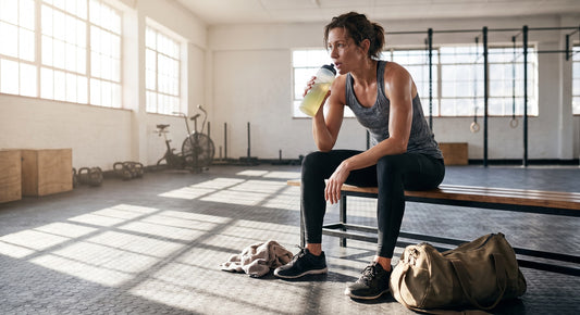 Person hydrating after a conditioning workout