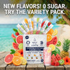 Salt of the Earth 35-stick variety pack with stick packs and fresh fruit on a beach table
